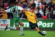 9 July 2000; Tommy Johnson of Celtic shoots to score his sides second goal despite the efforts of Jody Lunch of Bray Wanderers during the Pre-Season Friendly between Bray Wanderers and Celtic at the Carlisle Grounds in Bray, Wicklow. Photo by Ray Lohan/Sportsfile