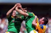 2 July 2000; Ronan Haslette, right, and Pat Farrell of Leitrim in action against Donal Casserly of Roscommon during the Bank of Ireland Connacht Senior Football Championship Semi-Final match between Roscommon and Leitrim at Dr Hyde Park in Roscommon. Photo by David Maher/Sportsfile