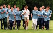 12 July 2000; 32 Counties were united for the ADIDAS Forever Sport Challenge in association with the ESB Community Games which was held in Dublin City University. The Forever Sport Challenge in Dublin was a fun-filled day of exciting activities for Community Games Athletes from all 32 counties. They met and trained with Irish track & field athletes, Catherina McKiernan (pictured with some of the athletes) and Terry McHugh, checked out the latest in Adidas technologies and were talent tested by the National Coaching & Training Centre. Photo By Brendan Moran/Sportsfile