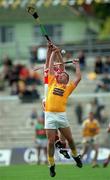 9 July 2000; Gary O'Kane of Antrim in action against Colin McEldowney of Derry during the Guinness Ulster Hurling Championship Final match between Derry and Antrim at Casement Park in Belfast. Photo By Aoife Rice/Sportsfile
