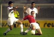 12 July 2000; Tony McCarthy of Shelbourne in action against Goran Janevski, left, and Goran Maznov of Sloga Jugomagnat during the UEFA Champions League 1st Qualfiying Round 1st Leg match between Sloga Jugomagnat and Shelbourne at  air Stadium in Skopje, Macedonia. Photo by David Maher/Sportsfile