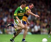 16 July 2000; Eamonn Fitzmaurice of Kerry in action against Martin Daly of Clare during the Bank of Ireland Munster Senior Football Championship Final between Kerry and Clare at the Gaelic Grounds in Limerick. Photo By Brendan Moran/Sportsfile