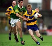 16 July 2000; Ronan Slattery of Clare in action against Aodan MacGearailt of Kerry during the Bank of Ireland Munster Senior Football Championship Final between Kerry and Clare at the Gaelic Grounds in Limerick. Photo By Brendan Moran/Sportsfile