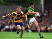16 July 2000; Aodan MacGearailt of Kerry in action against Ronan Slattery of Clare during the Bank of Ireland Munster Senior Football Championship Final between Kerry and Clare at the Gaelic Grounds in Limerick. Photo by Ray Lohan/Sportsfile
