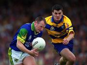 16 July 2000; Declan O'Keeffe of Kerry in action against Brian McMahon of Clare during the Bank of Ireland Munster Senior Football Championship Final between Kerry and Clare at the Gaelic Grounds in Limerick. Photo By Brendan Moran/Sportsfile