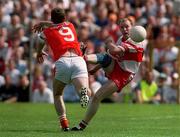 16 July 2000; Seamus Downey of Derry has a shot blocked by Tony McEntee of Armagh during the Bank of Ireland Ulster Senior Football Championship Final match between Armagh and Derry at St Tiernach's Park in Clones, Monaghan. Photo by David Maher/Sportsfile