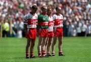 16 July 2000; Derry players from left, Sean Martin Lockhart, Eoin McCloskey, Kieran McKeever and Henry Downey stand for the national anthem ahead of the Bank of Ireland Ulster Senior Football Championship Final match between Armagh and Derry at St Tiernach's Park in Clones, Monaghan. Photo by Damien Eagers/Sportsfile
