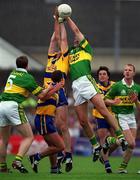 16 July 2000; Donal Daly of Kerry in action against Joe Considine of Clare during the Bank of Ireland Munster Senior Football Championship Final between Kerry and Clare at the Gaelic Grounds in Limerick. Photo By Brendan Moran/Sportsfile