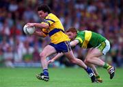16 July 2000; Mark O'Connell of Clare in action against Noel Kennelly of Kerry during the Bank of Ireland Munster Senior Football Championship Final between Kerry and Clare at the Gaelic Grounds in Limerick. Photo By Brendan Moran/Sportsfile