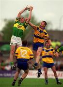 16 July 2000; Dara O'Se of Kerry in action against David Russell of Clare during the Bank of Ireland Munster Senior Football Championship Final between Kerry and Clare at the Gaelic Grounds in Limerick. Photo By Brendan Moran/Sportsfile