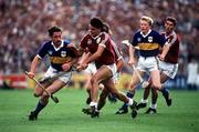 4 September 1988; Donie O'Connell of Tipperary in action against Gerry McInerney of Galway, also pictured are Aidan Ryan of Tipperary and Michael Coleman of Galway during the All-Ireland Senior Hurling Championship Final match between Galway and Tipperary at Croke Park in Dublin. Photo by Ray McManus/Sportsfile