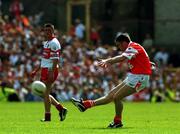 16 July 2000; Oisin McConville of Armagh kicks the winning point from a free during the Bank of Ireland Ulster Senior Football Championship Final match between Armagh and Derry at St Tiernach's Park in Clones, Monaghan. Photo by David Maher/Sportsfile