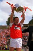 16 July 2000; Armagh captain Kieran McGeeney lifts the Anglo Celt Cup following the Bank of Ireland Ulster Senior Football Championship Final match between Armagh and Derry at St Tiernach's Park in Clones, Monaghan. Photo by Damien Eagers/Sportsfile