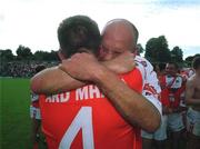 16 July 2000; Armagh players Justin McNulty, left, and Gerard Reid celebrate following the Bank of Ireland Ulster Senior Football Championship Final match between Armagh and Derry at St Tiernach's Park in Clones, Monaghan. Photo by David Maher/Sportsfile