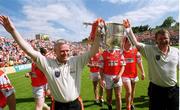 16 July 2000; Armagh joint managers Brian McAlinden, left, and Brian Canavan celebrate with the Anglo Celt Cup following the Bank of Ireland Ulster Senior Football Championship Final match between Armagh and Derry at St Tiernach's Park in Clones, Monaghan. Photo by David Maher/Sportsfile