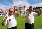 16 July 2000; Armagh joint managers Brian McAlinden, left, and Brian Canavan celebrate with the Anglo Celt Cup following the Bank of Ireland Ulster Senior Football Championship Final match between Armagh and Derry at St Tiernach's Park in Clones, Monaghan. Photo by David Maher/Sportsfile