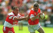 16 July 2000; Steven McDonnell of Armagh in action against Gary Coleman of Derry during the Bank of Ireland Ulster Senior Football Championship Final match between Armagh and Derry at St Tiernach's Park in Clones, Monaghan. Photo by David Maher/Sportsfile
