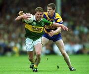 16 July 2000; Dara O'Cinneide of Kerry in action against Conor Whelan of Clare during the Bank of Ireland Munster Senior Football Championship Final between Kerry and Clare at the Gaelic Grounds in Limerick. Photo By Brendan Moran/Sportsfile