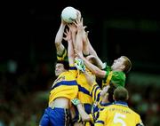 16 July 2000; Kerry's Liam Hassett, right, and Dara O'Se, hidden, contest a high ball with Mark O'Connell, left, and Donal O'Sullivan of Clare during the Bank of Ireland Munster Senior Football Championship Final between Kerry and Clare at the Gaelic Grounds in Limerick. Photo By Brendan Moran/Sportsfile