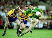 16 July 2000; Aodan MacGearailt of Kerry in action against Barry Keating of Clare during the Bank of Ireland Munster Senior Football Championship Final between Kerry and Clare at the Gaelic Grounds in Limerick. Photo By Brendan Moran/Sportsfile