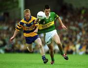 16 July 2000; Aodan MacGearailt of Kerry in action against Ronan Slattery of Clare during the Bank of Ireland Munster Senior Football Championship Final between Kerry and Clare at the Gaelic Grounds in Limerick. Photo by Ray Lohan/Sportsfile