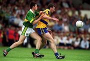 16 July 2000; Brian Considine of Clare in action against Aodan MacGearailt of Kerry during the Bank of Ireland Munster Senior Football Championship Final between Kerry and Clare at the Gaelic Grounds in Limerick. Photo By Brendan Moran/Sportsfile