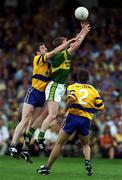 16 July 2000; Michael F Russell of Kerry in action against Conor Whelan of Clare as Padraig Gallagher of Clare watches on during the Bank of Ireland Munster Senior Football Championship Final between Kerry and Clare at the Gaelic Grounds in Limerick. Photo By Brendan Moran/Sportsfile