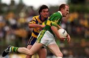 16 July 2000; Liam Hassett of Kerry in action against Mark O'Connell of Clare during the Bank of Ireland Munster Senior Football Championship Final between Kerry and Clare at the Gaelic Grounds in Limerick. Photo by Ray Lohan/Sportsfile