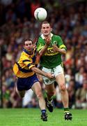 16 July 2000; Donal Daly of Kerry in action against Barry Keating of Clare during the Bank of Ireland Munster Senior Football Championship Final between Kerry and Clare at the Gaelic Grounds in Limerick. Photo by Ray Lohan/Sportsfile