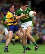 16 July 2000; Aodan MacGearailt of Kerry in action against Barry Keating of Clare during the Bank of Ireland Munster Senior Football Championship Final between Kerry and Clare at the Gaelic Grounds in Limerick. Photo By Brendan Moran/Sportsfile