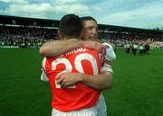 16 July 2000; Armagh players Kieran McGeeney, right, and Diarmaid Marsden celebrate following the Bank of Ireland Ulster Senior Football Championship Final match between Armagh and Derry at St Tiernach's Park in Clones, Monaghan. Photo by David Maher/Sportsfile