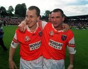16 July 2000; Armagh players Paddy McKeever, left, and Steven McDonnell celebrate following the Bank of Ireland Ulster Senior Football Championship Final match between Armagh and Derry at St Tiernach's Park in Clones, Monaghan. Photo by David Maher/Sportsfile