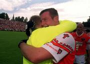 16 July 2000; Armagh players Justin McNulty and Brendan Tierney celebrate following the Bank of Ireland Ulster Senior Football Championship Final match between Armagh and Derry at St Tiernach's Park in Clones, Monaghan. Photo by David Maher/Sportsfile