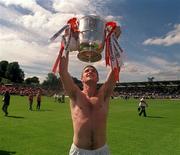 16 July 2000; Tony McEntee of Armagh celebrates with the Anglo Celt Cup following the Bank of Ireland Ulster Senior Football Championship Final match between Armagh and Derry at St Tiernach's Park in Clones, Monaghan. Photo by Damien Eagers/Sportsfile