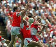 16 July 2000; Paul McGrane and Gerard Reid of Armagh in action against Enda Muldoon of Derry during the Bank of Ireland Ulster Senior Football Championship Final match between Armagh and Derry at St Tiernach's Park in Clones, Monaghan. Photo by David Maher/Sportsfile