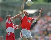 16 July 2000; Steven McDonnell of Armagh in action against Garry Coleman of Derry during the Bank of Ireland Ulster Senior Football Championship Final match between Armagh and Derry at St Tiernach's Park in Clones, Monaghan. Photo by David Maher/Sportsfile