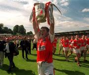 16 July 2000; Kieran Hughes of Armagh celebrates with the Anglo Celt Cup following the Bank of Ireland Ulster Senior Football Championship Final match between Armagh and Derry at St Tiernach's Park in Clones, Monaghan. Photo by David Maher/Sportsfile