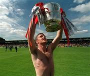 16 July 2000; Tony McEntee of Armagh celebrates with the Anglo Celt Cup following the Bank of Ireland Ulster Senior Football Championship Final match between Armagh and Derry at St Tiernach's Park in Clones, Monaghan. Photo by David Maher/Sportsfile