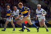 28 May 2000; Declan Ryan of Tipperary in action against Fergal Hartley of Waterford during the Guinness Munster Senior Hurling Quarter-Final match between Tipperary and Waterford at Pairc Ui Chaoimh in Cork. Photo By Brendan Moran/Sportsfile