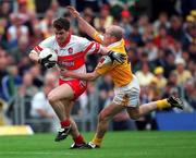 2 July 2000; Joe Brolly of Derry in action against Anto Finnegan of Antrim during the Bank of Ireland Ulster Football Championship Semi-Final Replay match between Antrim and Derry at Casement Park in Belfast. Photo By Aoife Rice/Sportsfile