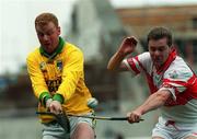 23 July 2000; Stephen Byrne of Offaly in action against John O'Dwyer of Derry during the Guinness All-Ireland Senior Hurling Championship Quarter-Final match between Offaly and Derry at Croke Park in Dublin. Photo by John Mahon/Sportsfile