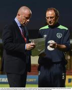 31 May 2016; Republic of Ireland Martin O'Neill hands his UEFA EURO2016 squad list to FAI Head of Communications Ian Mallon on the pitch following the EURO2016 Warm-up International between Republic of Ireland and Belarus in Turners Cross, Cork. Photo by David Maher/Sportsfile