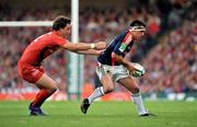 24 May 2008; Rua Tipoki, Munster, side steps Yannick Jauzion, Toulouse. Heineken Cup Final, Munster v Toulouse, Millennium Stadium, Cardiff, Wales. Picture credit: Brendan Moran / SPORTSFILE