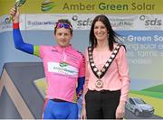 4 May 2015; Overall race winner Mark Dowling, DID Dunboyne, with Linda Dillon, Chairperson of Mid-Ulster District Council, on the awards podium after the fourth stage of the AmberGreen Energy Tour of Ulster. 150 elite cyclists from Australia, Holland, Belgium, France, England, Scotland, Northern Ireland and the Republic of Ireland compete in Stage 4 of the AmberGreen Energy Tour of Ulster in partnership with the SDS Group and Saltmarine Cars. Stage 4 is a circuit race around Cookstown taking the cyclists through William Street - Orritor Road - Tulnacross Road - Flo Road - Omagh Road - Tullagh Road  - Fairhill Road - James Street - William Street - Cookstown. Picture credit: Stephen McMahon / SPORTSFILE