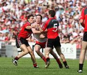 8 June 2008; Colm Cavanagh, Tyrone, in action against Daniel Hughes and Aidan Carr, Down. GAA Football Ulster Senior Championship Quarter-Final, Tyrone v Down, Healy Park, Omagh, Co. Tyrone. Picture credit: Oliver McVeigh / SPORTSFILE