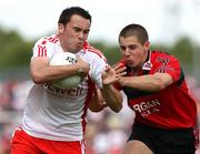 8 June 2008; Kyle Coney, Tyrone, in action against Pauric O'Rourke, Down. ESB Ulster Minor Football Championship Quarter-Final, Tyrone v Down, Healy Park, Omagh, Co. Tyrone. Picture credit: Oliver McVeigh / SPORTSFILE
