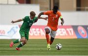 7 May 2015; Timothy Fosu-Mensah, The Netherlands, in action against Connor Ronan, Republic of Ireland. UEFA European U17 Championship Finals Group D, Republic of Ireland v Netherlands. Sozopol Stadium, Sozopol, Bulgaria. Picture credit: Pat Murphy / SPORTSFILE