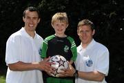 7 June 2008; Seven-year-old Darragh Lyne from Killarney, Co Kerry, with eircom league players Keith Fahey, left, St Patrick's Athletic, and Joe Gamble, Cork City, at the Danone Nations Cup National Finals. Darragh was a finalist in the supporters competition. AUL Complex, Clonshaugh, Dublin. Picture credit: Ray McManus / SPORTSFILE  *** Local Caption *** to Kerry papers