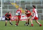14 June 2008; Arlene McCloskey, Tyrone in action against Kyla Trainor and Orla Fegan Down. Ulster Ladies Football Championship Semi-Final, Down v Tyrone, Pairc Esler, Newry, Co. Down. Picture credit: Oliver McVeigh / SPORTSFILE