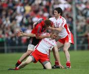 14 June 2008; Benny Coulter, Down, in dispute with Kevin Hughes, Tyrone, as Ciaran Gourley comes in to break them up. GAA Football Ulster Senior, Down v Tyrone, Pairc Esler, Newry, Co. Down. Picture credit: Oliver McVeigh / SPORTSFILE